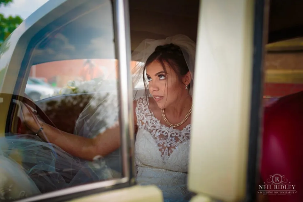 Bride gets out of her Bridal car at St Thomas Church in St Annes-on-Sea