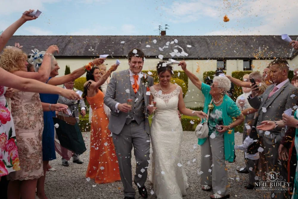 Bride and Groom arrive to a Confetti shower at The Great Hall of Mains