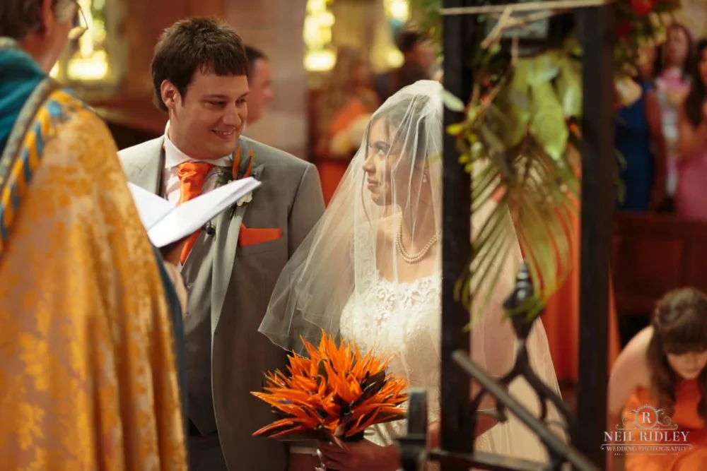 Bride and Groom at altar of St Thomas Church in St Annes-on-Sea