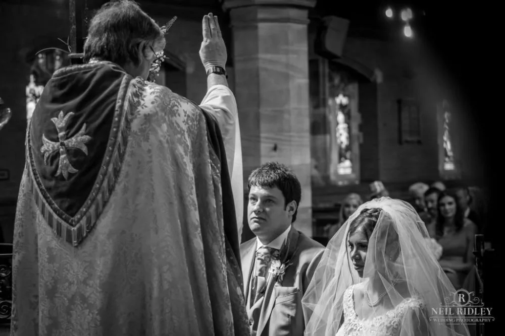 Bride and groom at the Altar St Thomas Church in St Annes-on-Sea