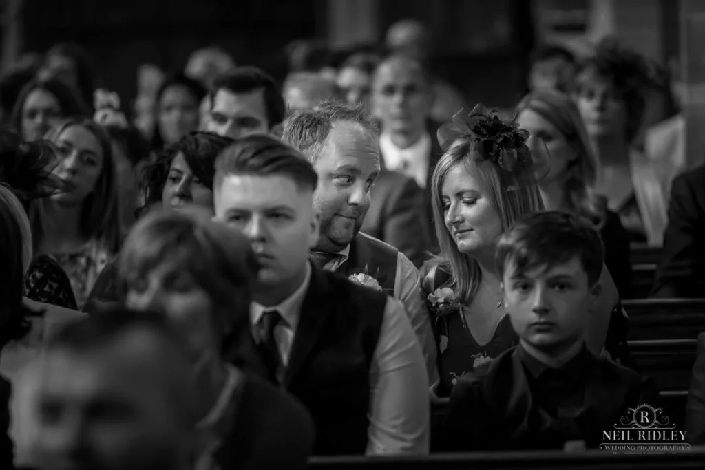 Black and white image of Wedding Guests in St Thomas Church in St Annes-on-Sea