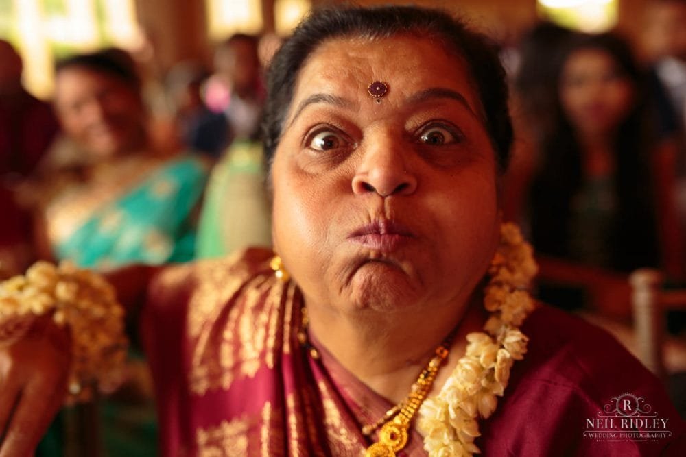 Merrydale Manor Wedding Photographer - Wedding Guest puffing up her face