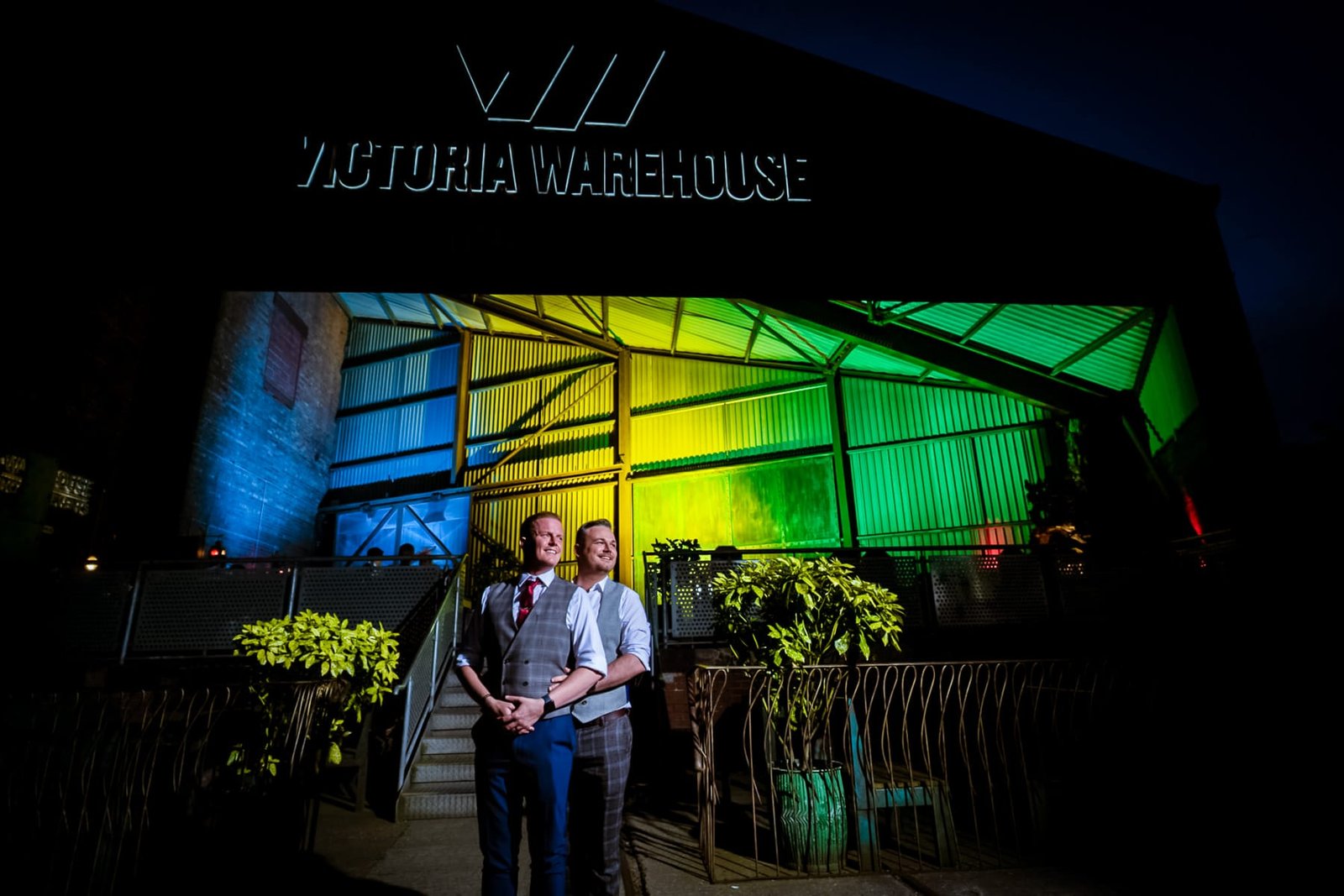 Victoria Warehouse Grooms Pose outside