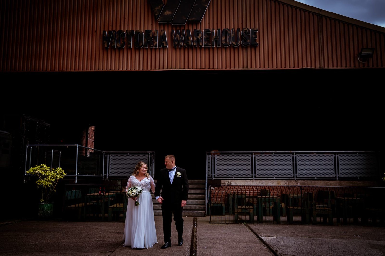 Victoria Warehouse Bride and Groom walk outside