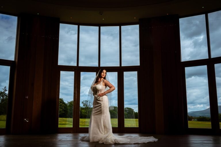 The Out Barn Wedding Photographer Posing in the window